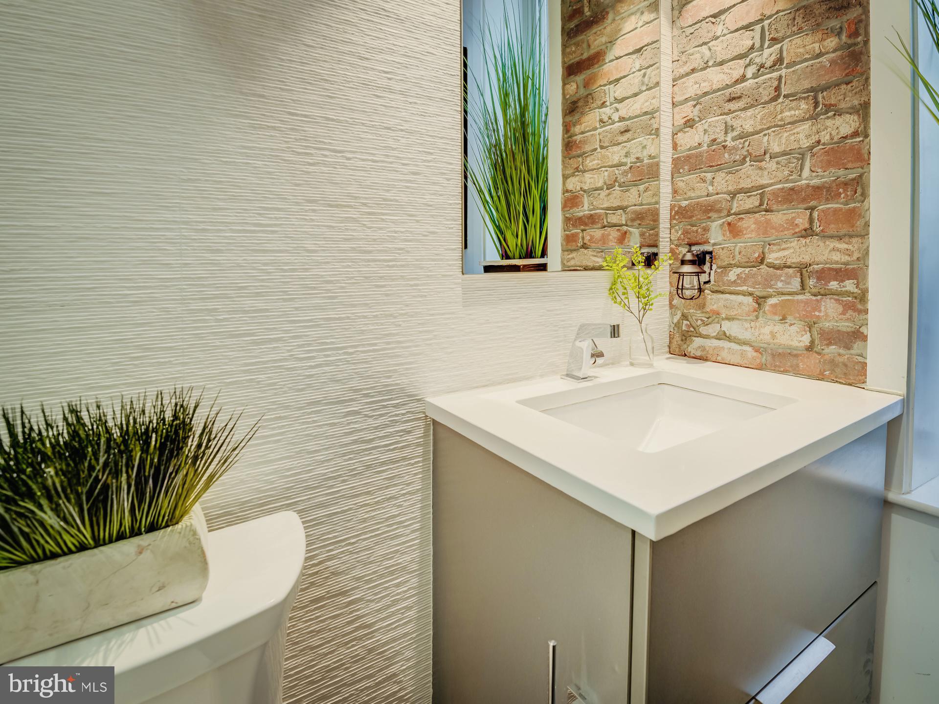 3527 14th Street Northwest, Unit 2 Washington, DC 20010 - Photo 15 of 19 a bathroom with a sink and a mirror
