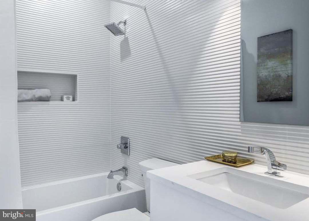 3527 14th Street Northwest, Unit 2 Washington, DC 20010 - Photo 10 of 19 a bathroom with a sink and a bathtub