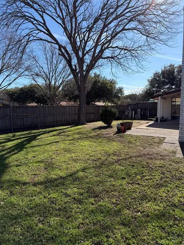 a view of a house with a big yard