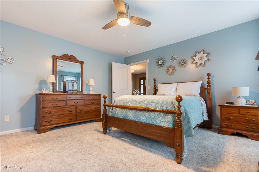 6408 Rustic Ridge Circle Northwest Massillon, OH 44646 - Photo 23 of 31 Carpeted bedroom featuring ceiling fan