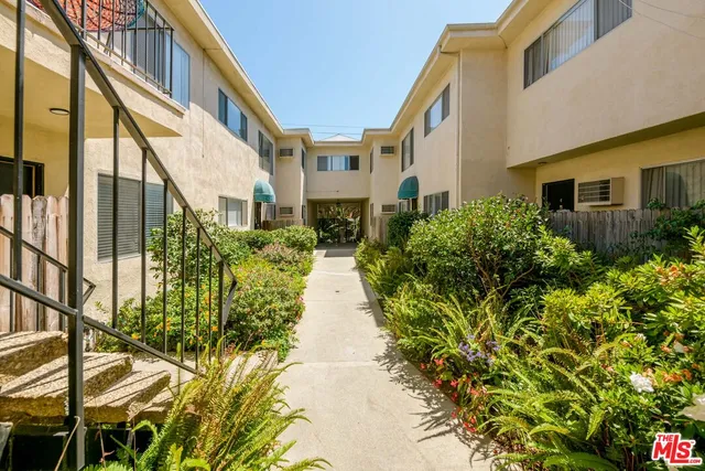 a view of a building with a yard