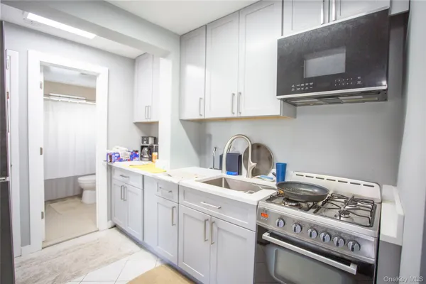 a kitchen with a stove and a sink