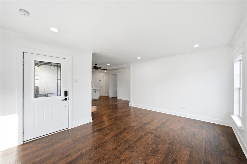 2712 Live Oak Avenue Waco, TX 76708 - Photo 2 of 15 an empty room with wooden floor & windows