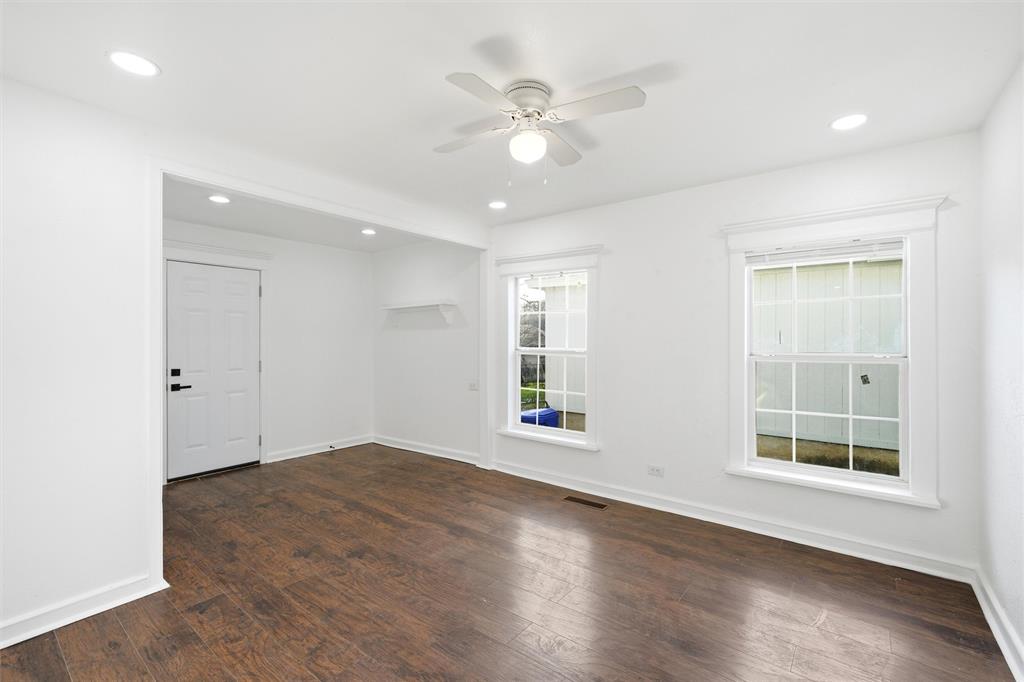 2712 Live Oak Avenue Waco, TX 76708 - Photo 8 of 15 an empty room with wooden floor and windows