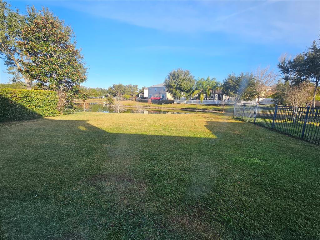 1881 Strathmore Circle Mount Dora, FL 32757 - Photo 16 of 16 a view of an ocean and trees in the background