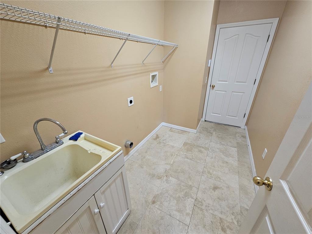 1881 Strathmore Circle Mount Dora, FL 32757 - Photo 6 of 16 a bathroom with a sink and a mirror