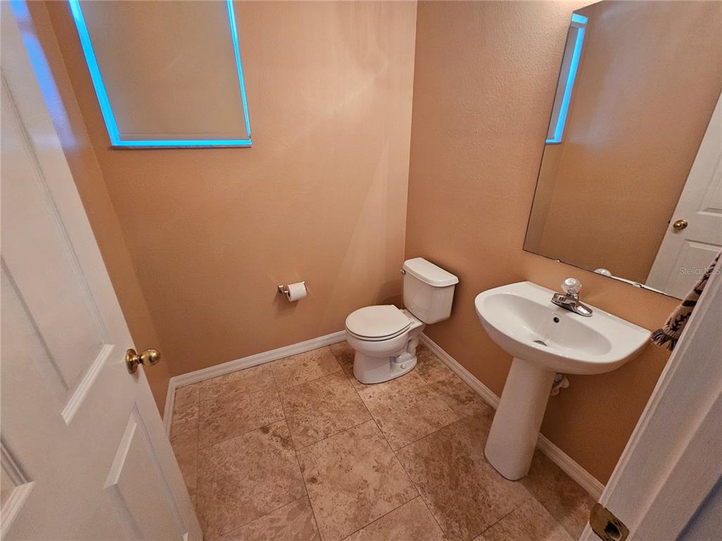 1881 Strathmore Circle Mount Dora, FL 32757 - Photo 7 of 16 a bathroom with a sink and a mirror