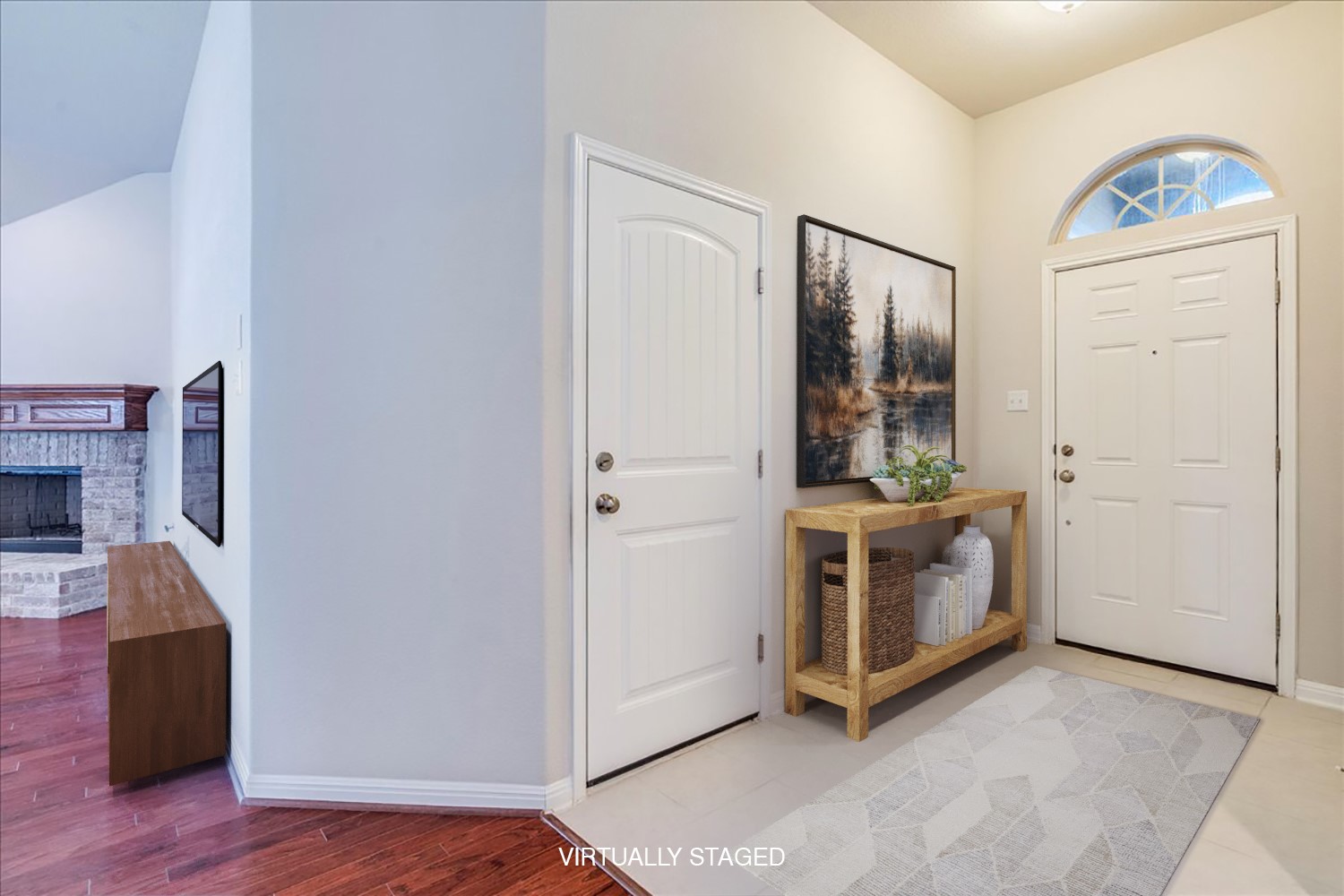 161 Mistflower Lane Kyle, TX 78640 - Photo 32 of 37 Entryway with a brick fireplace and light wood-style flooring