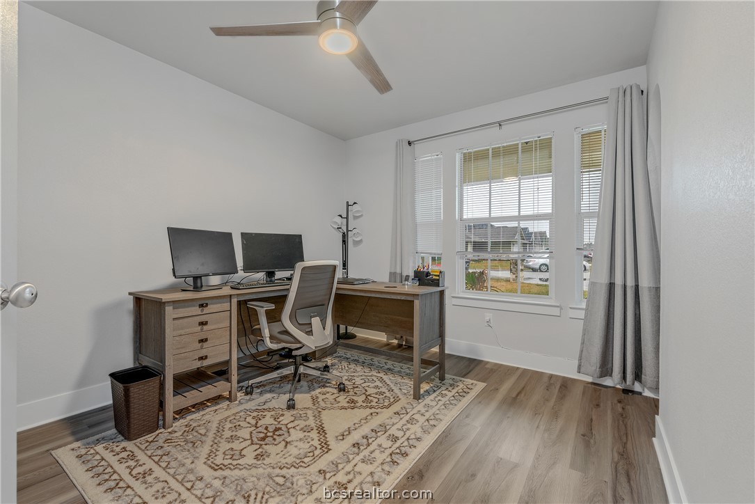 1027 Fallbrook Loop College Station, TX 77845 - Photo 13 of 20 a view of a workspace with furniture and a window