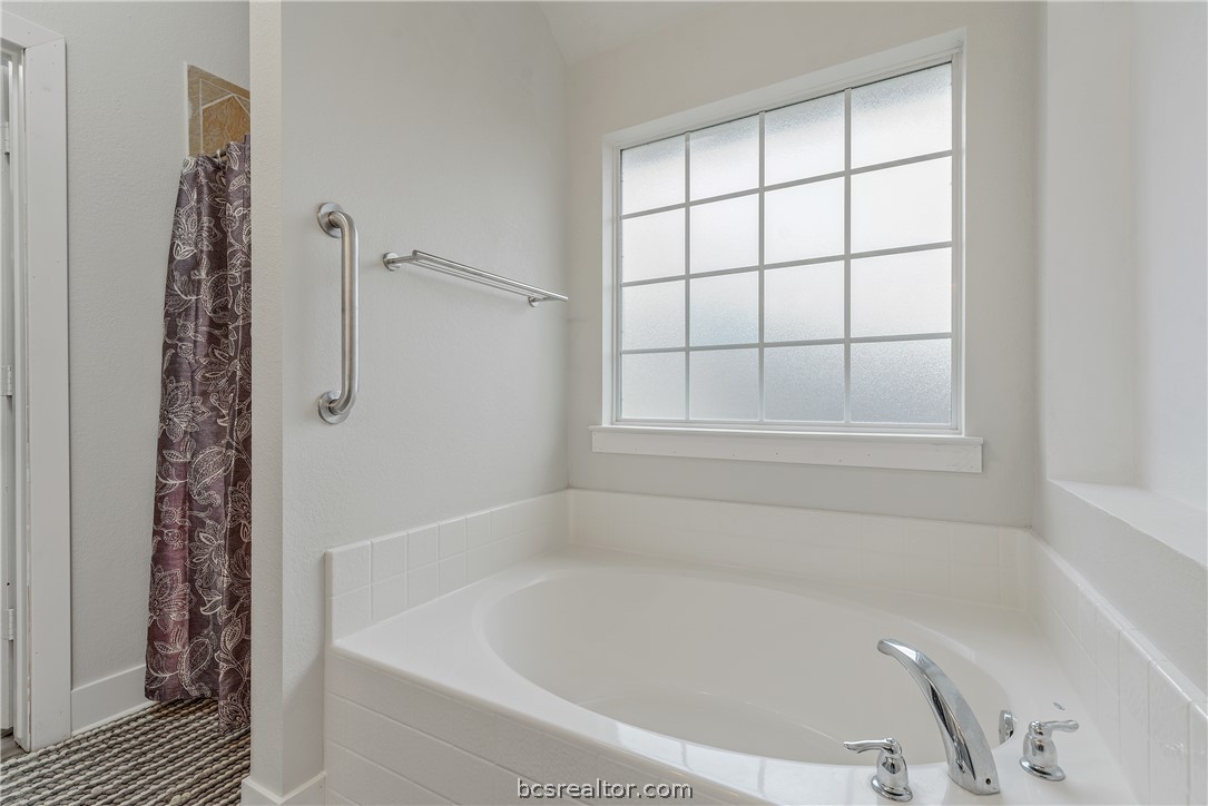 1027 Fallbrook Loop College Station, TX 77845 - Photo 17 of 20 a white bath tub sitting next to a window
