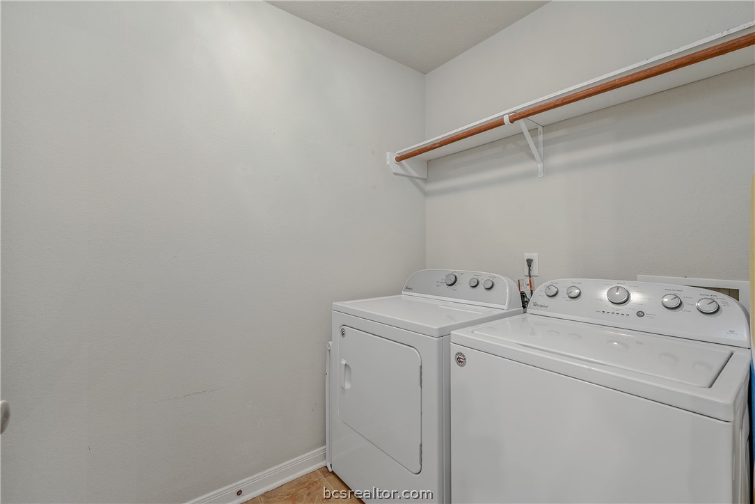 1027 Fallbrook Loop College Station, TX 77845 - Photo 18 of 20 a view of storage and utility room with washer and dryer