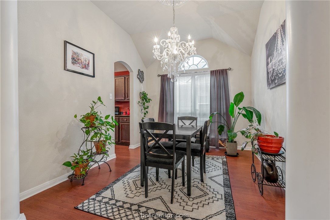 1027 Fallbrook Loop College Station, TX 77845 - Photo 3 of 20 a view of a dining room with furniture and chandelier