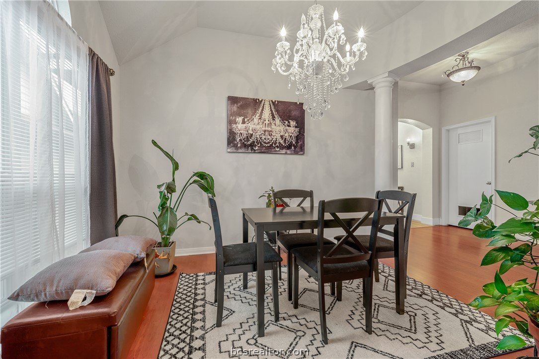 1027 Fallbrook Loop College Station, TX 77845 - Photo 4 of 20 a view of a dining room with furniture window and wooden floor