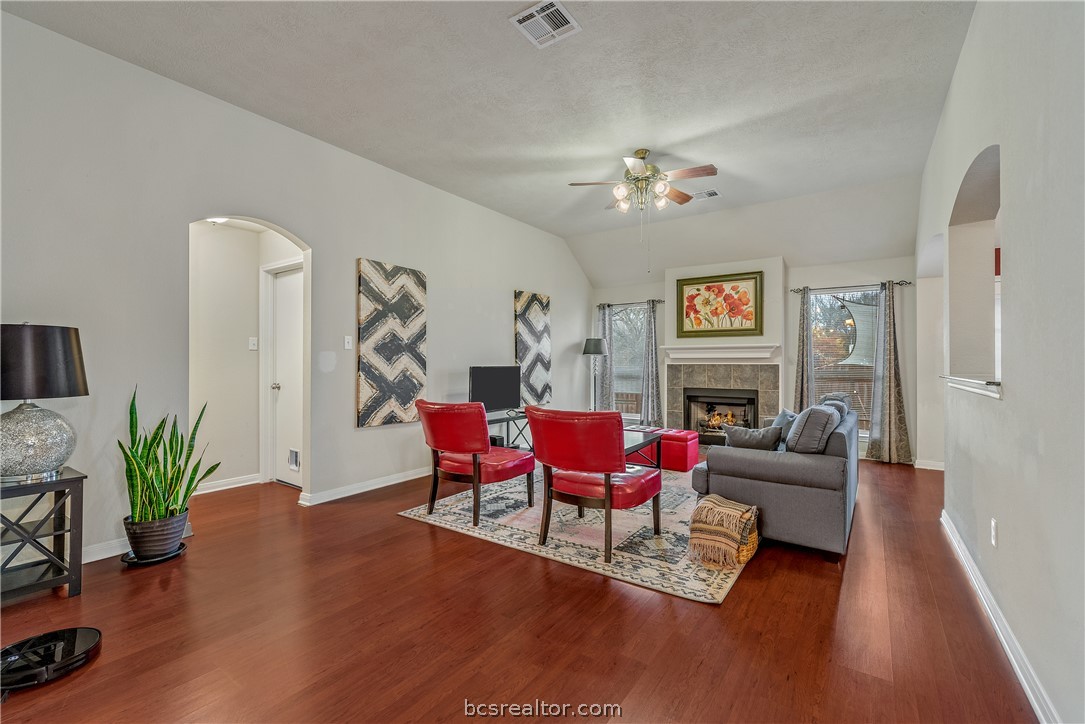 1027 Fallbrook Loop College Station, TX 77845 - Photo 5 of 20 a living room with furniture flower pot and a fireplace
