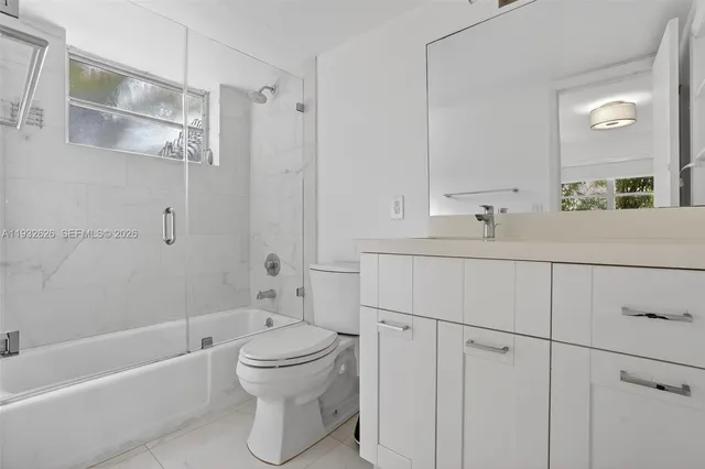 a view of a bathroom with a shower and a toilet