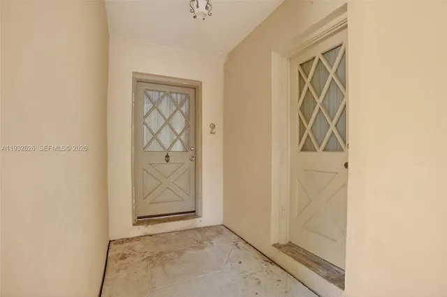 a kitchen with a stove a sink and a refrigerator