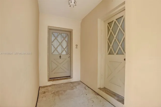 a kitchen with a refrigerator sink and cabinets