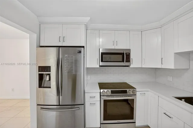 a view of an empty room with windows