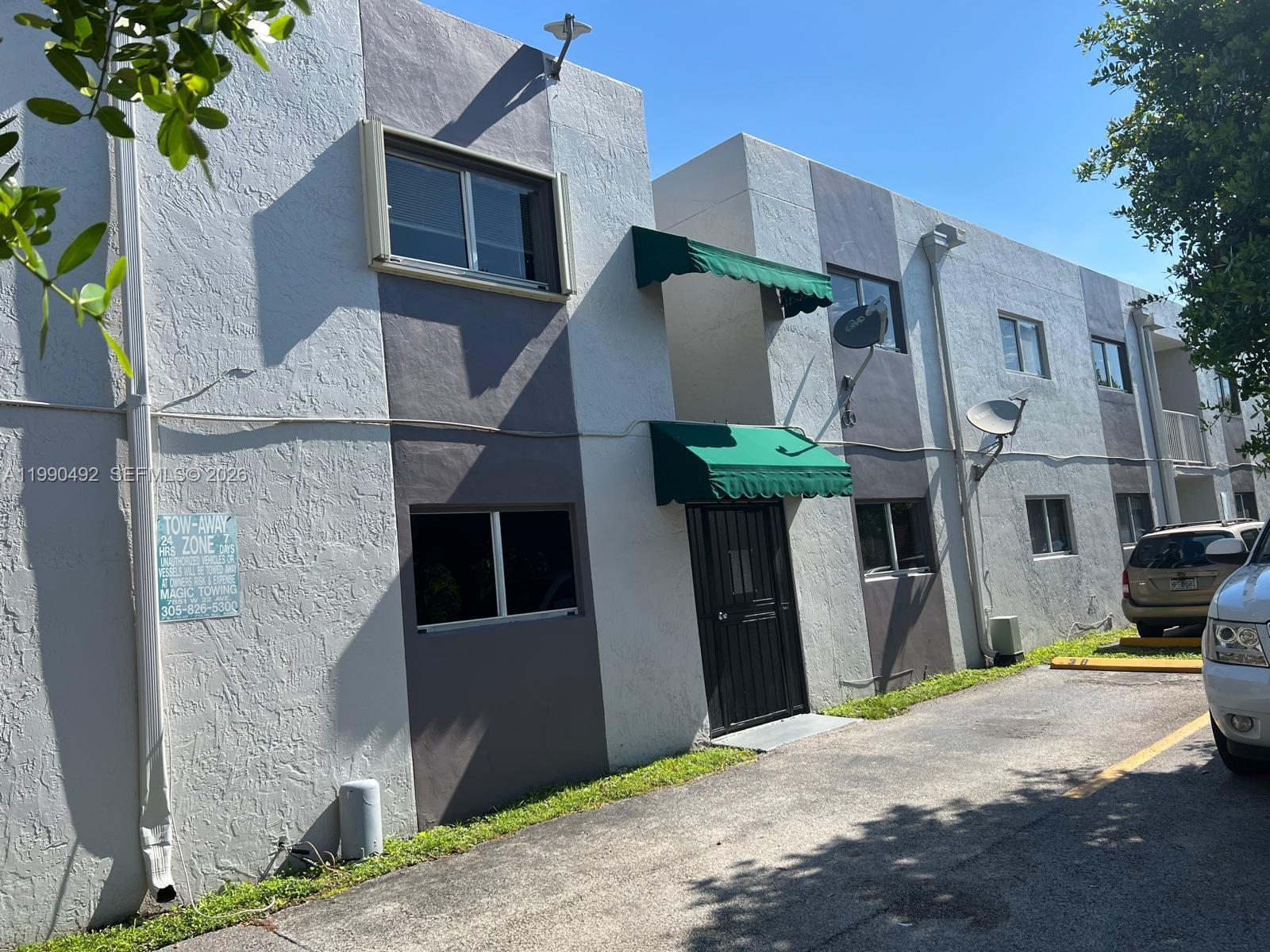 2565 West 56th Street, Unit 209 Hialeah, FL 33016 - Photo 1 of 10 a front view of a house with garden