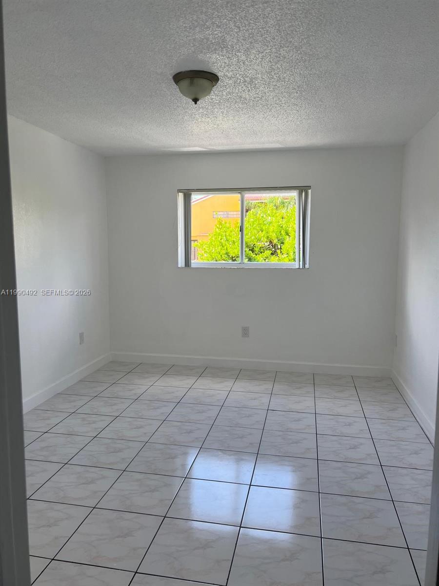 2565 West 56th Street, Unit 209 Hialeah, FL 33016 - Photo 8 of 10 a view of room with window