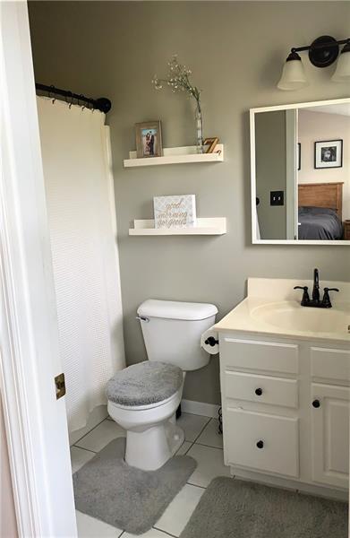 212 Grace Street McKees Rocks, PA 15136 - Photo 14 of 25 Updated master bath with tile flooring.