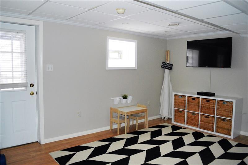212 Grace Street McKees Rocks, PA 15136 - Photo 20 of 25 Bonus game room with walkout to outdoor living space.