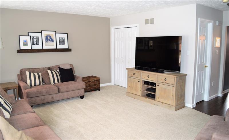 212 Grace Street McKees Rocks, PA 15136 - Photo 3 of 25 Large living room with storage closet and open layout to dining and kitchen area.