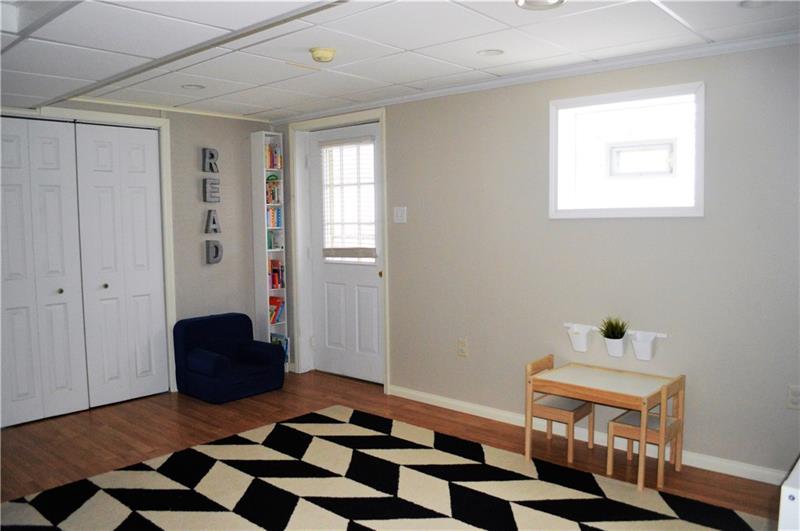 212 Grace Street McKees Rocks, PA 15136 - Photo 21 of 25 Spacious game room leads into garage, laundry room or outdoors.