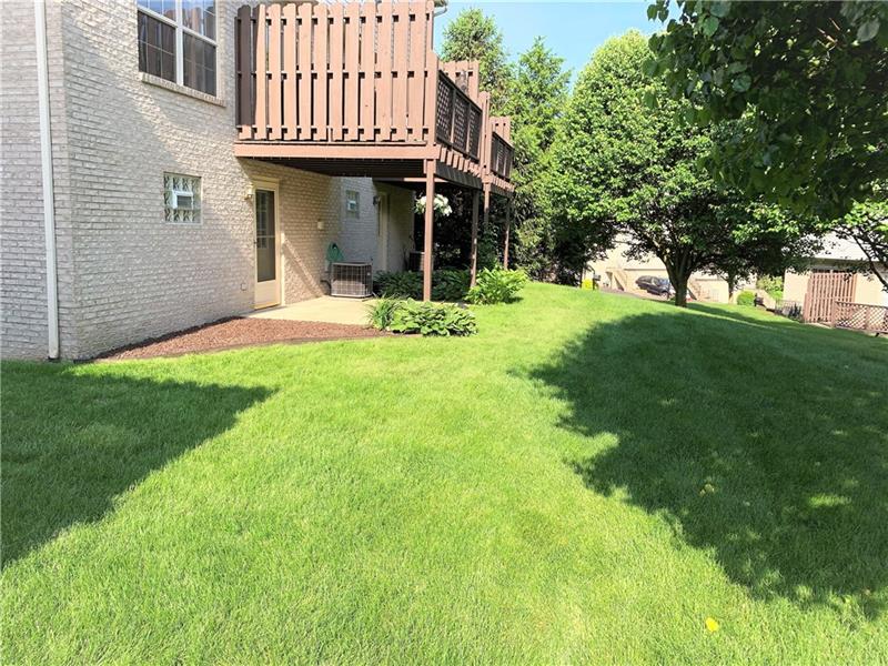 212 Grace Street McKees Rocks, PA 15136 - Photo 24 of 25 Outdoor deck and covered patio space flow into back yard.