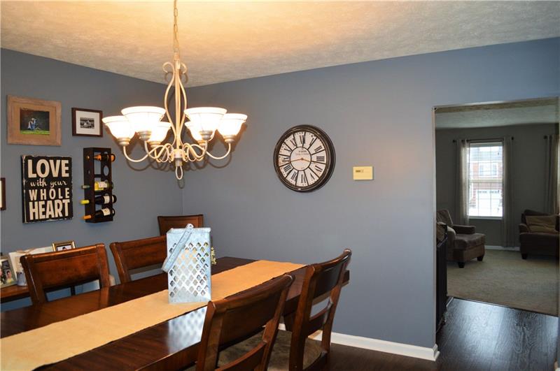 212 Grace Street McKees Rocks, PA 15136 - Photo 7 of 25 Dining room opens to living room and kitchen to create a open feel and perfect entertaining layout.