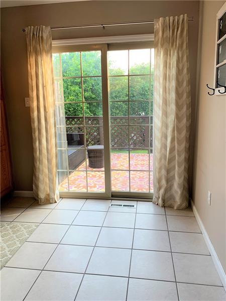 212 Grace Street McKees Rocks, PA 15136 - Photo 10 of 25 French doors lead out of kitchen to a private back deck perfect for entertaining.