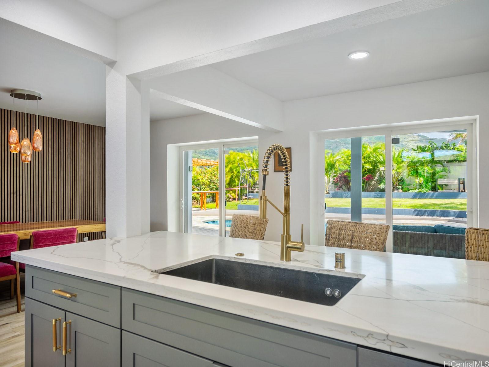 6815 Niumalu Loop Honolulu, HI 96825 - Photo 10 of 25 Kitchen views out toward pool and yard area