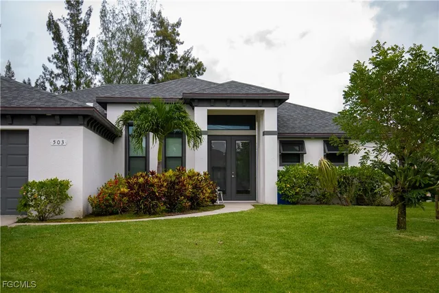 a front view of a house with garden