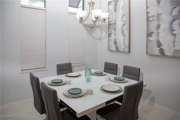 a view of a dining room that has a table and chairs