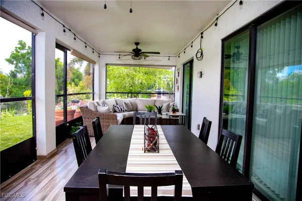 a view of a dining room with furniture window and outside view