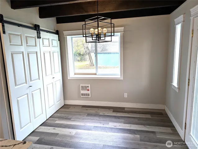 a kitchen with stainless steel appliances granite countertop a wooden floors