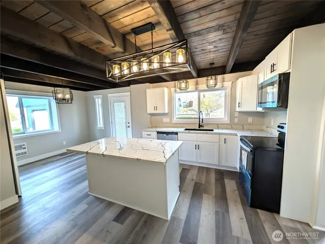 a view of empty room with windows