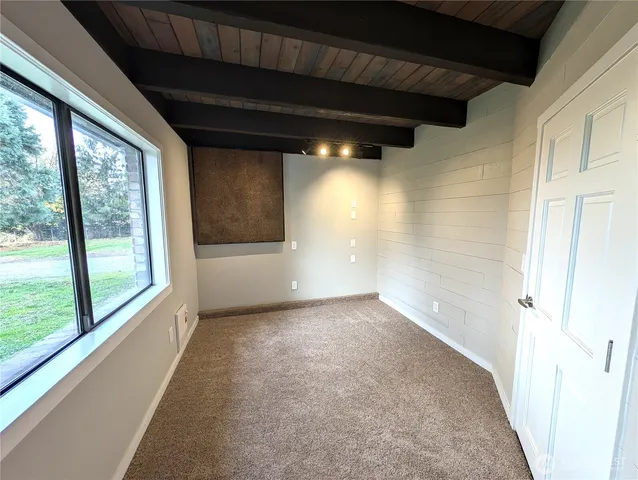 a view of front door with wooden floor and stairs