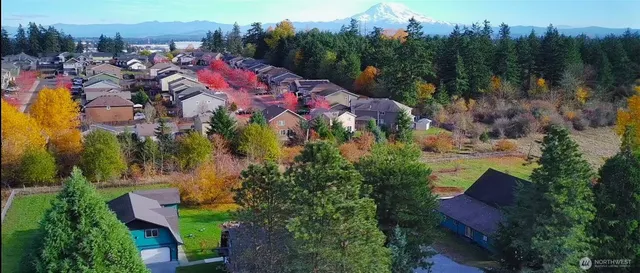 a kitchen with stainless steel appliances granite countertop a stove and a refrigerator