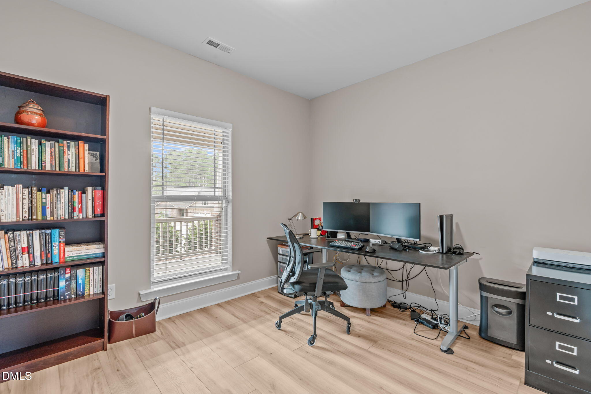 90 Cypress Ridge Way. Willow Spring, NC 27592 - Photo 21 of 52 Currently used as a home office, new flooring in space, window overlooking the covered front porch.