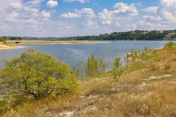 a view of a lake with a big yard