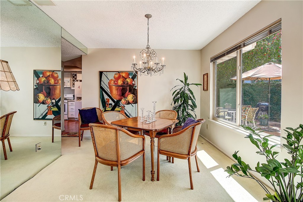 6618 Wintertree Drive Riverside, CA 92506 - Photo 12 of 37 a view of a dining room with furniture window and outside view