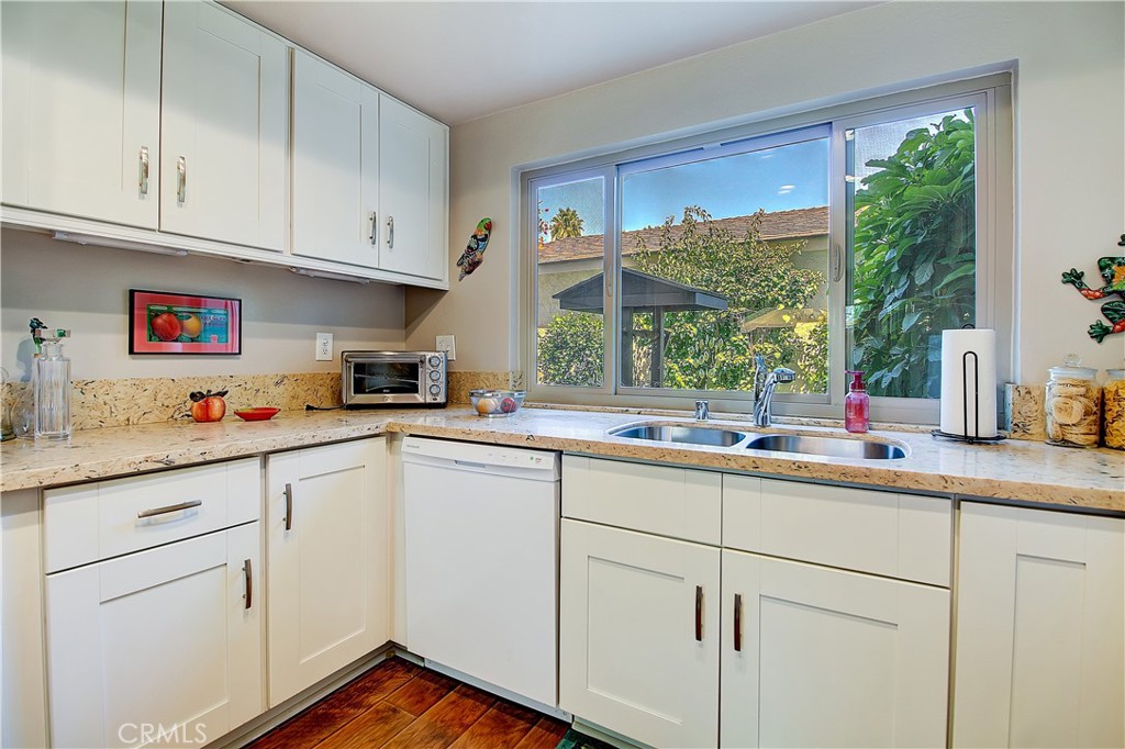 6618 Wintertree Drive Riverside, CA 92506 - Photo 15 of 37 a kitchen with appliances cabinets and a sink