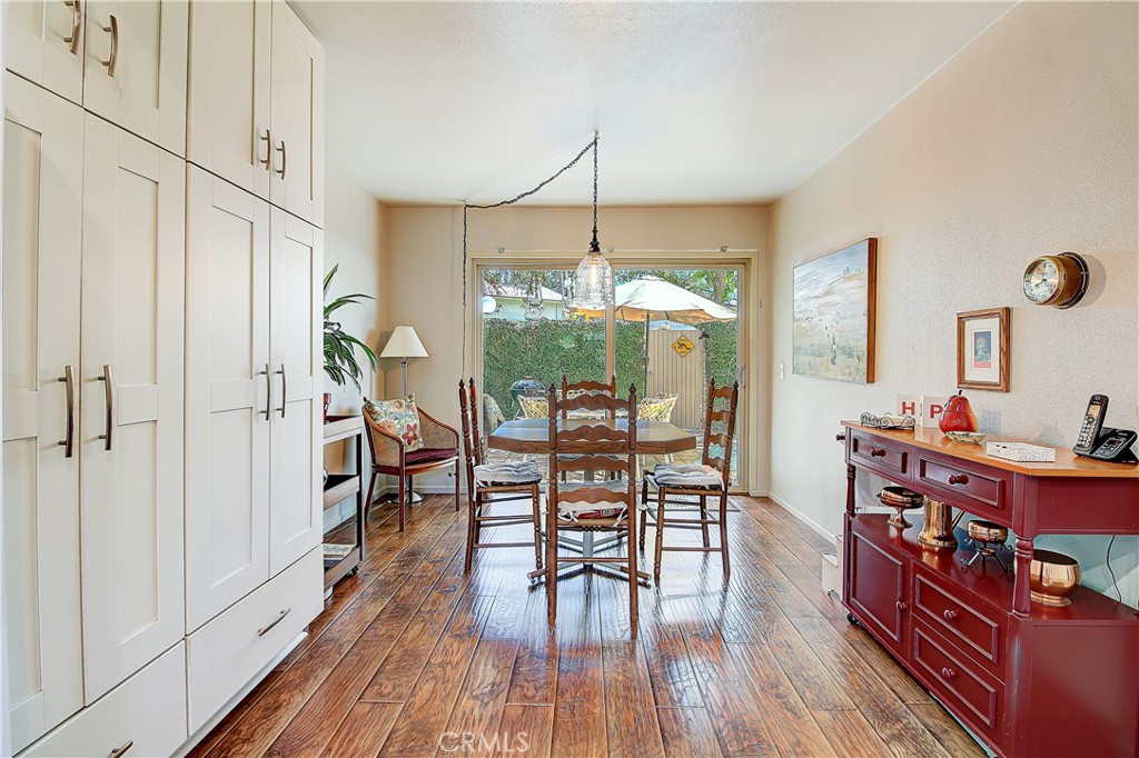 6618 Wintertree Drive Riverside, CA 92506 - Photo 17 of 37 a dining room with furniture window and wooden floor
