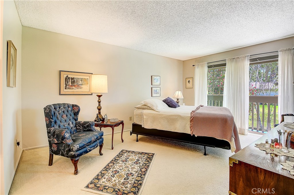 6618 Wintertree Drive Riverside, CA 92506 - Photo 20 of 37 a bedroom with furniture and a window