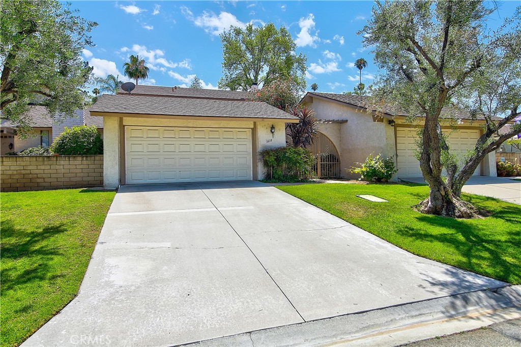 6618 Wintertree Drive Riverside, CA 92506 - Photo 2 of 37 a front view of a house with yard and green space