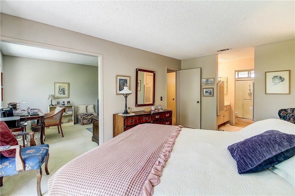 6618 Wintertree Drive Riverside, CA 92506 - Photo 23 of 37 a bedroom with a bed and a couch