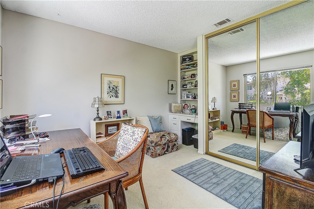 6618 Wintertree Drive Riverside, CA 92506 - Photo 24 of 37 a living room with furniture and a wooden floor