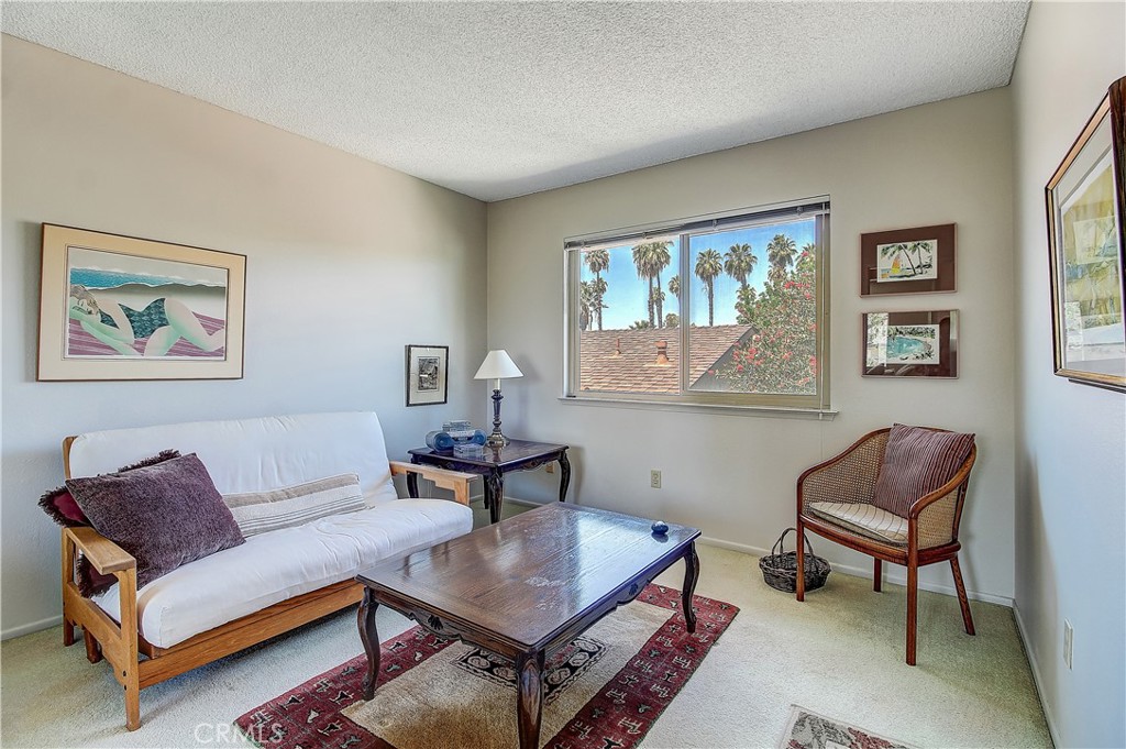 6618 Wintertree Drive Riverside, CA 92506 - Photo 26 of 37 a living room with furniture and a window