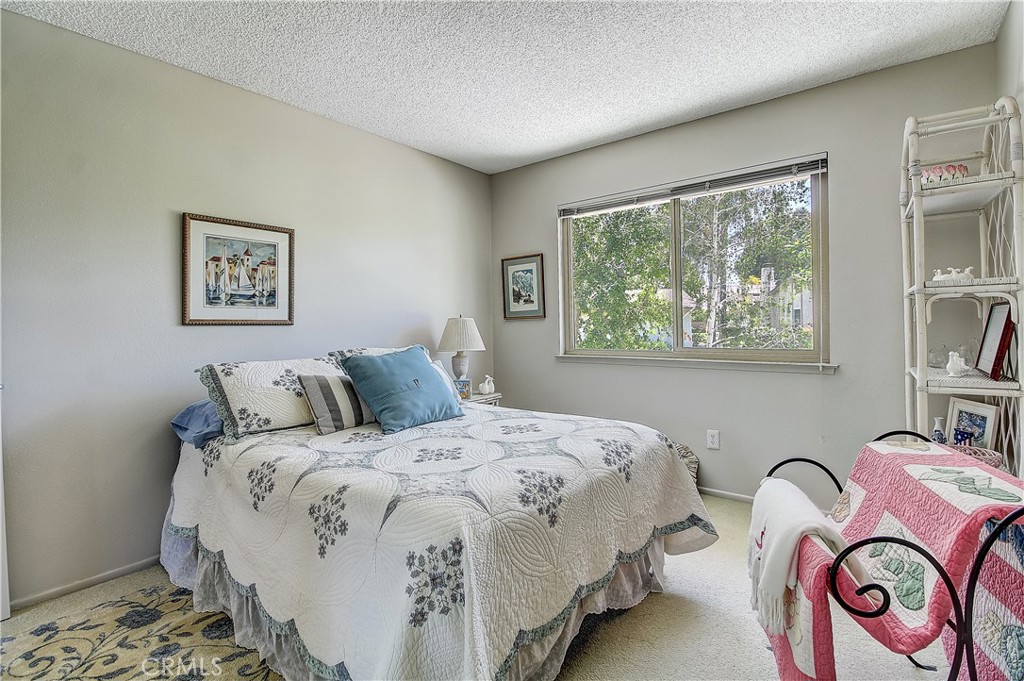6618 Wintertree Drive Riverside, CA 92506 - Photo 28 of 37 a bedroom with bed and a window